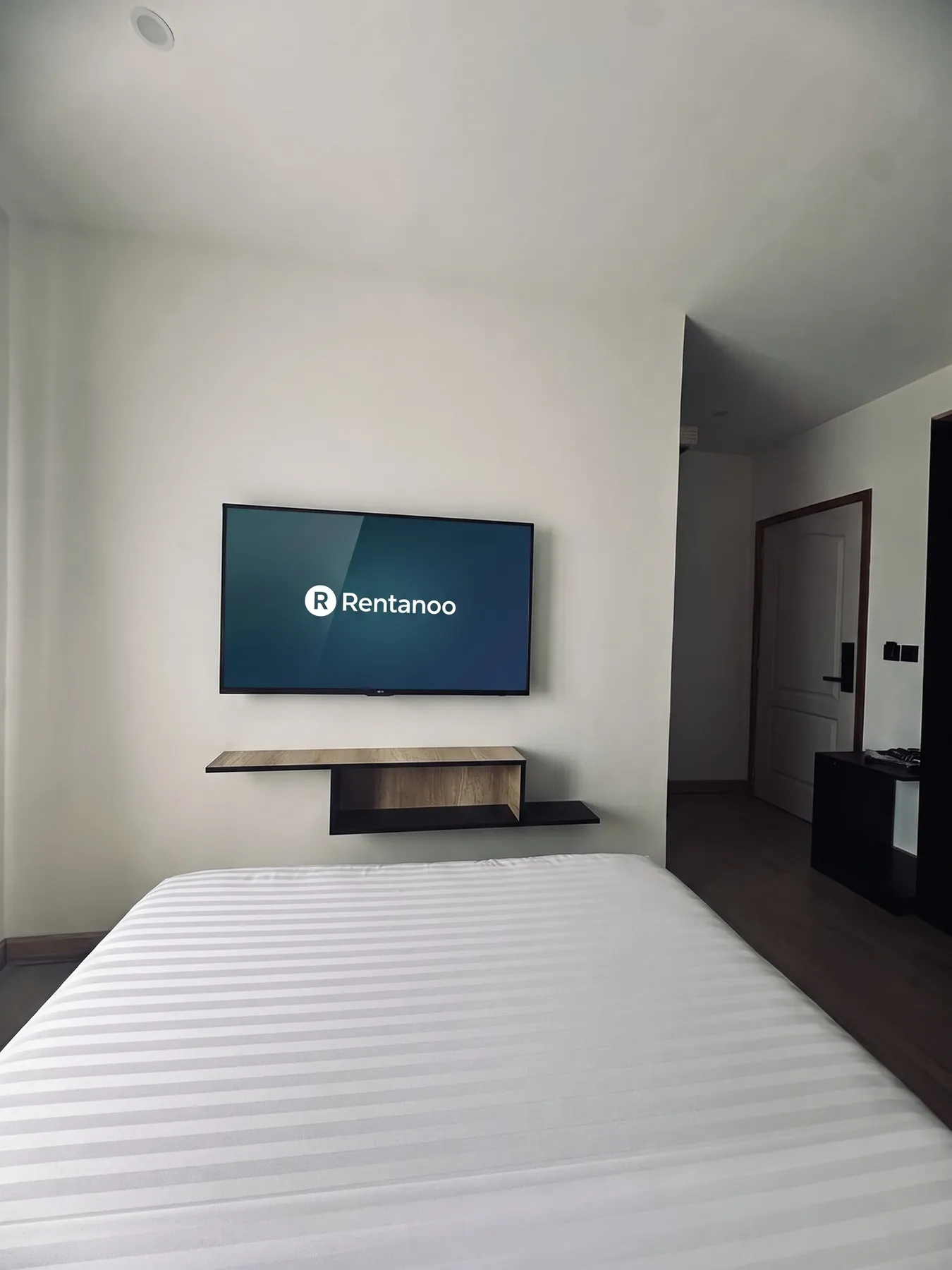 AM Résidence — le lit double face à la TV
